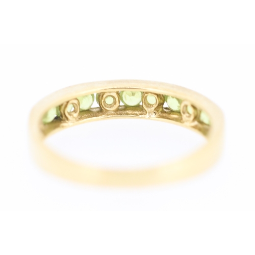 127 - Peridot Nine Stone Set Ring Mounted in 9 Carat Yellow Gold Ring Size N