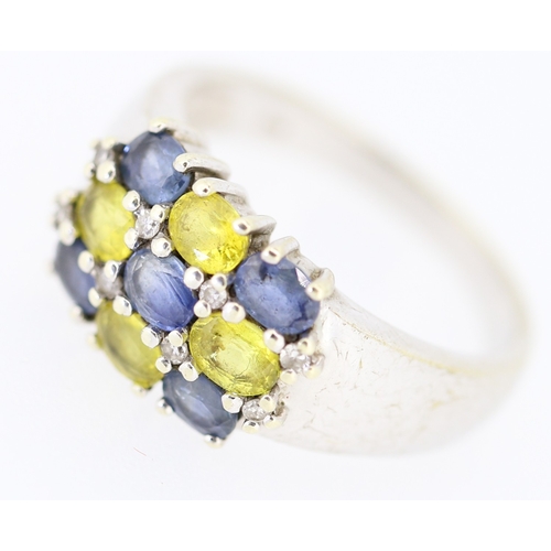 139 - Blue Topaz and Yellow Tourmaline Set Nine Stone Ring Mounted in 9 Carat White Gold Ring Size O and a... 