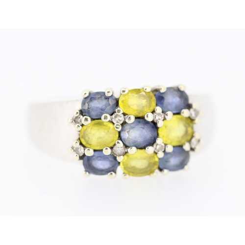 139 - Blue Topaz and Yellow Tourmaline Set Nine Stone Ring Mounted in 9 Carat White Gold Ring Size O and a... 