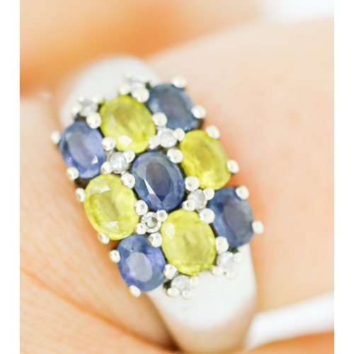 139 - Blue Topaz and Yellow Tourmaline Set Nine Stone Ring Mounted in 9 Carat White Gold Ring Size O and a... 