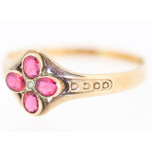 140 - Ruby Floral Form Ring with Seed Pearl Inset Mounted in 9 Carat Yellow Gold Ring Size R