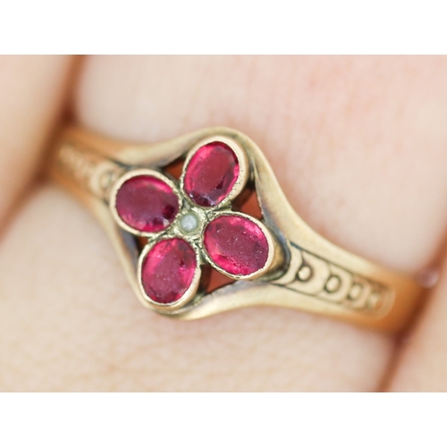 140 - Ruby Floral Form Ring with Seed Pearl Inset Mounted in 9 Carat Yellow Gold Ring Size R