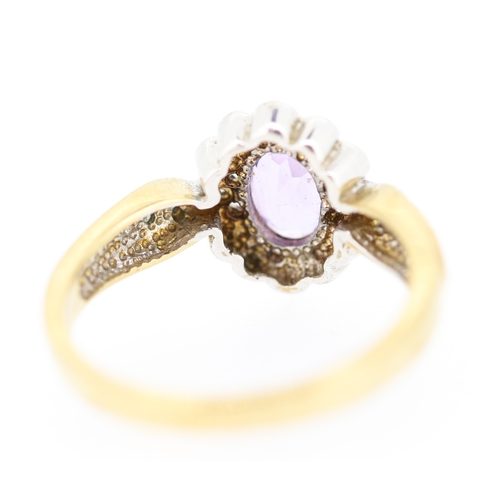 144 - Amethyst Set Ladies Ring with Diamond Insets Mounted in 9 Carat Yellow Gold Ring Size N and a Half