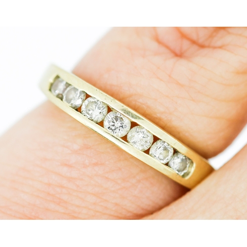 147 - Diamond Seven Stone Channel Set Ring Mounted in 9 Carat Yellow Gold Ring Size K and a Half