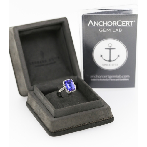 15 - Emerald Cut AAAA Vivid Tanzanite Centre Stone Ring with Diamond Set Halo Surround and Further Diamon... 