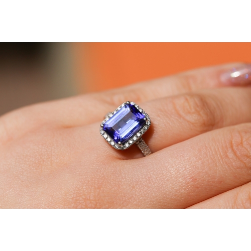 15 - Emerald Cut AAAA Vivid Tanzanite Centre Stone Ring with Diamond Set Halo Surround and Further Diamon... 