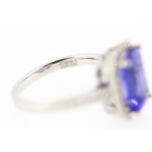 15 - Emerald Cut AAAA Vivid Tanzanite Centre Stone Ring with Diamond Set Halo Surround and Further Diamon... 