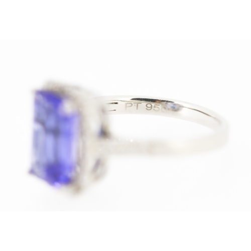 15 - Emerald Cut AAAA Vivid Tanzanite Centre Stone Ring with Diamond Set Halo Surround and Further Diamon... 