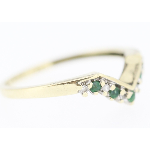 188 - Emerald and Diamond Set Wishbone Ring Mounted in 9 Carat Yellow Gold Ring Size P and a Half