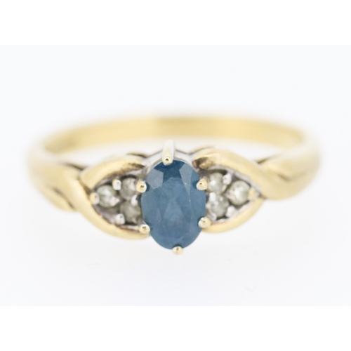 216 - Blue Topaz and Diamond Set Ring Mounted in 9 Carat Yellow Gold Ring Size O