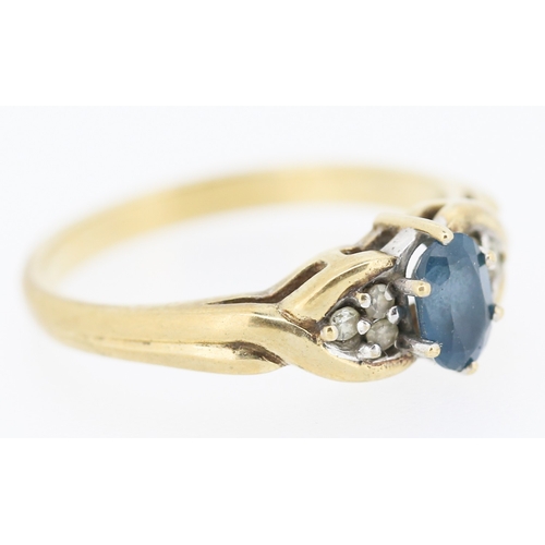 216 - Blue Topaz and Diamond Set Ring Mounted in 9 Carat Yellow Gold Ring Size O