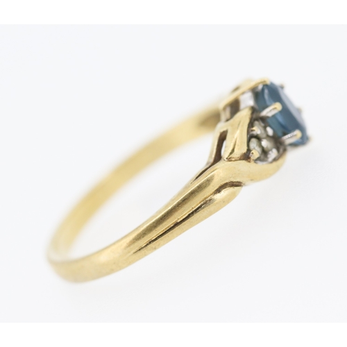 216 - Blue Topaz and Diamond Set Ring Mounted in 9 Carat Yellow Gold Ring Size O