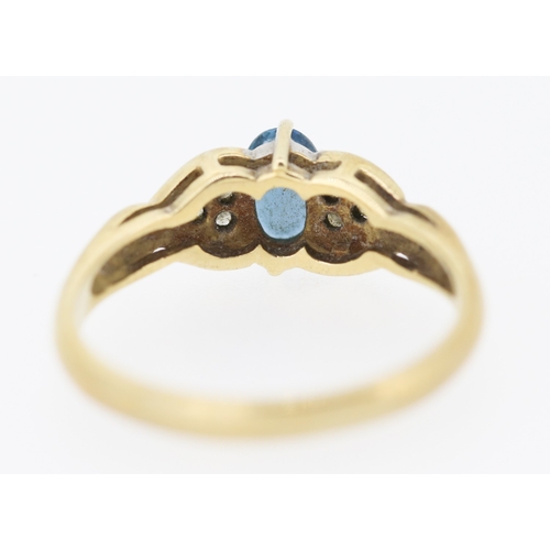 216 - Blue Topaz and Diamond Set Ring Mounted in 9 Carat Yellow Gold Ring Size O