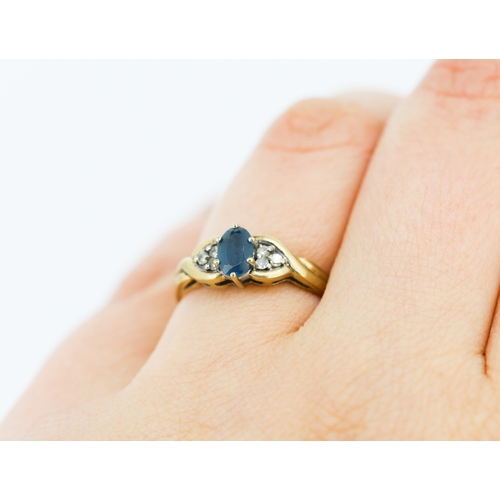 216 - Blue Topaz and Diamond Set Ring Mounted in 9 Carat Yellow Gold Ring Size O