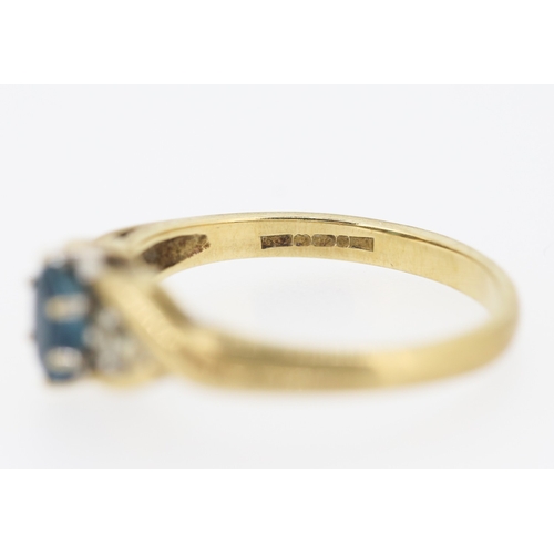 216 - Blue Topaz and Diamond Set Ring Mounted in 9 Carat Yellow Gold Ring Size O