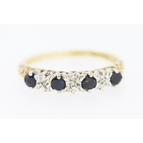 220 - Sapphire Four Stone Ring with Diamond Insets Mounted in 9 Carat Yellow Gold Ring Size O and a Half