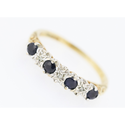 220 - Sapphire Four Stone Ring with Diamond Insets Mounted in 9 Carat Yellow Gold Ring Size O and a Half