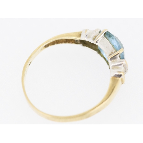 231 - Aquamarine Set Ring with Diamond Insets to Shoulders Mounted in 9 Carat Yellow Gold Ring Size M