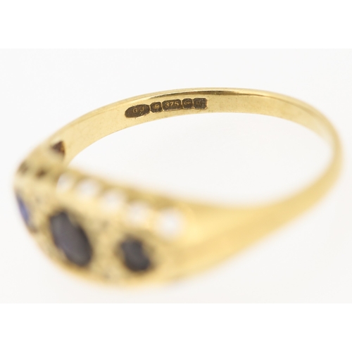 235 - Sapphire Three Stone Ring with Diamond Insets Mounted in 9 Carat Yellow Gold Ring Size N