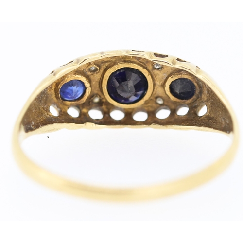 235 - Sapphire Three Stone Ring with Diamond Insets Mounted in 9 Carat Yellow Gold Ring Size N