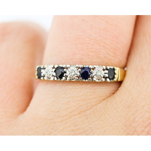 236 - Sapphire Four Stone Ring with Diamond Insets Mounted in 9 Carat Yellow Gold Ring Size Q