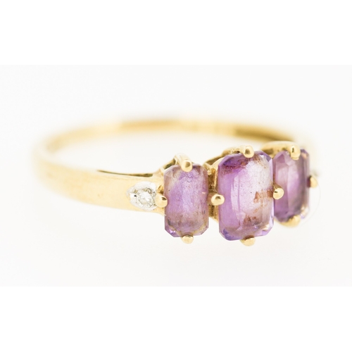 238 - Amethyst Three Stone Set Ring with Diamond Insets to Shoulders Mounted in 9 Carat Yellow Gold Ring S... 