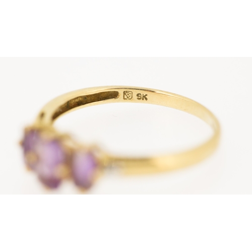 238 - Amethyst Three Stone Set Ring with Diamond Insets to Shoulders Mounted in 9 Carat Yellow Gold Ring S... 