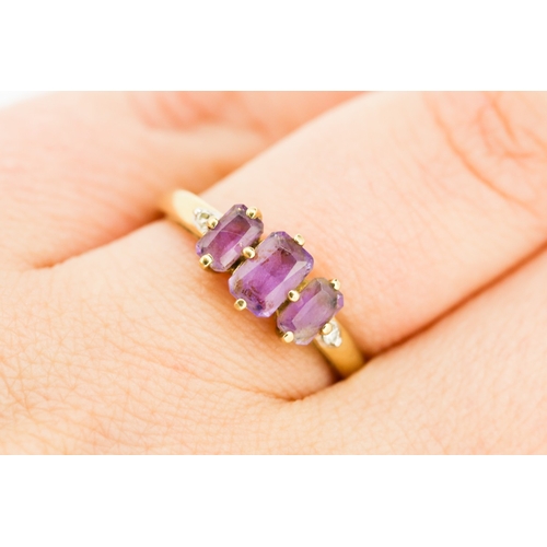 238 - Amethyst Three Stone Set Ring with Diamond Insets to Shoulders Mounted in 9 Carat Yellow Gold Ring S... 