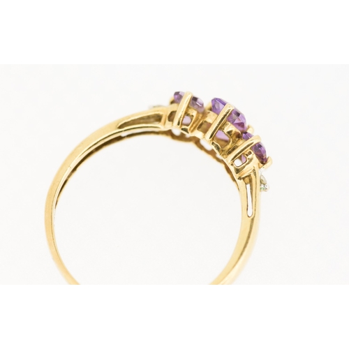 238 - Amethyst Three Stone Set Ring with Diamond Insets to Shoulders Mounted in 9 Carat Yellow Gold Ring S... 