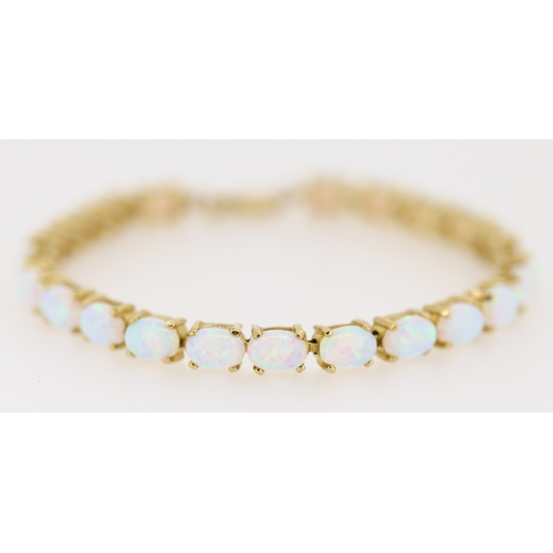 24 - Opal Twenty Two Stone Set Bracelet Mounted in 9 Carat Yellow Gold 18cm Long