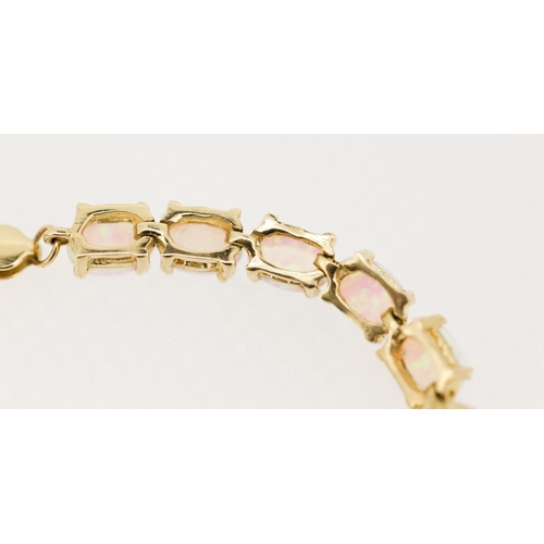 24 - Opal Twenty Two Stone Set Bracelet Mounted in 9 Carat Yellow Gold 18cm Long