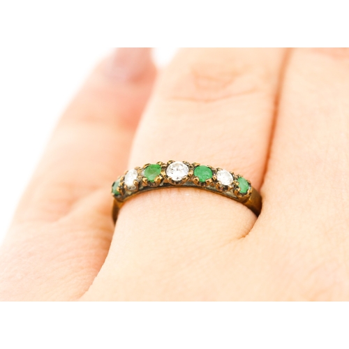 251 - Emerald and Diamond Set Seven Stone Ring Mounted in 9 Carat Rose Gold Ring Size O and a Half