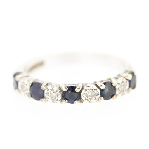 252 - Sapphire Five Stone Ring with Diamond Insets Mounted in 9 Carat White Gold Ring Size N