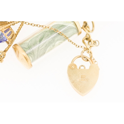 261 - 9 Carat Yellow Gold Charm Bracelet Including 1 Pound Note Charm Claddagh Motif Charm and Others 16cm... 