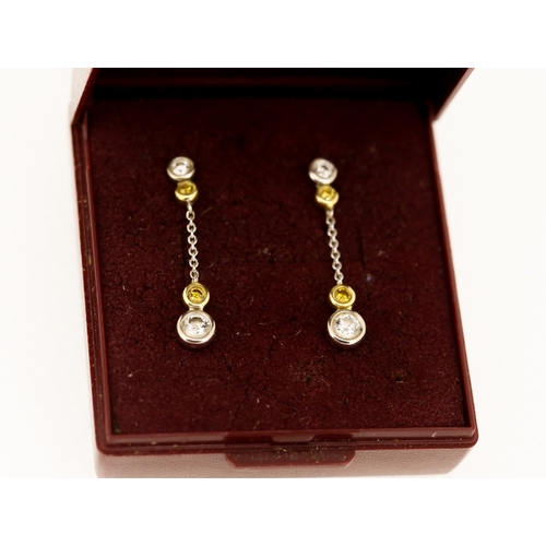 271 - Pair of Diamond and Fancy Yellow Diamond Four Stone Bezel Set Drop Earrings Mounted in 18 Carat Whit... 