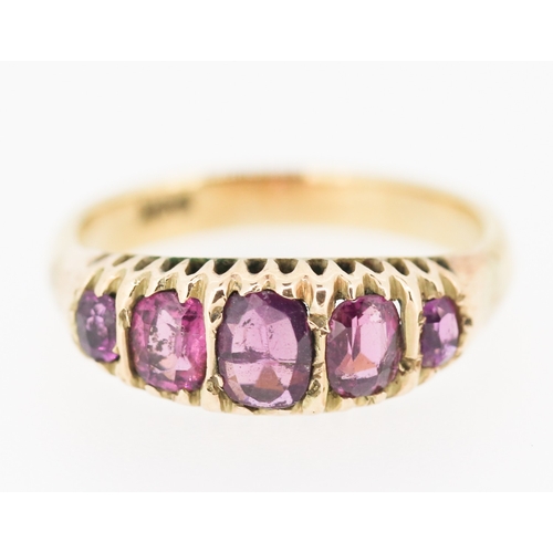 276 - Pink Garnet Five Stone Graduated Form Ring Mounted in 9 Carat Yellow Gold Ring Size M and a Half