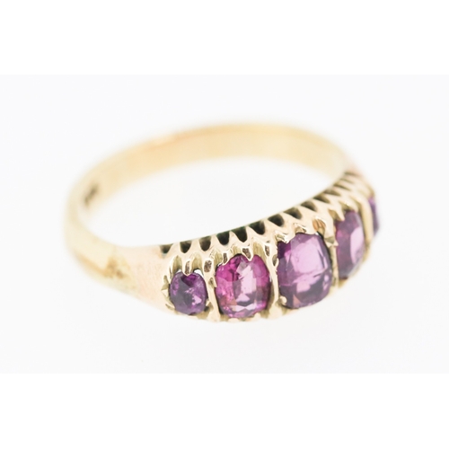 276 - Pink Garnet Five Stone Graduated Form Ring Mounted in 9 Carat Yellow Gold Ring Size M and a Half