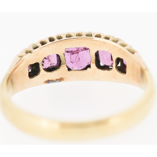 276 - Pink Garnet Five Stone Graduated Form Ring Mounted in 9 Carat Yellow Gold Ring Size M and a Half