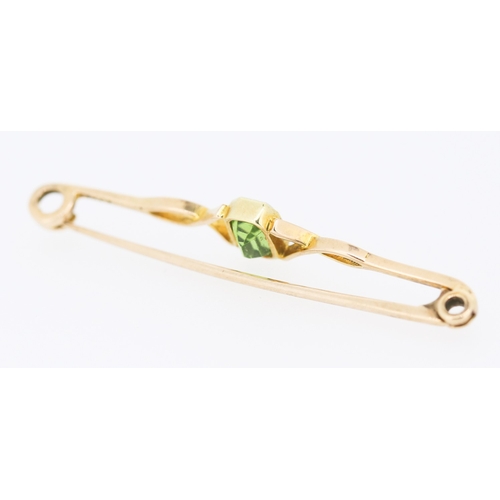 279 - Bezel Set Peridot Brooch Mounted in 15 Carat Yellow Gold 5cm Wide