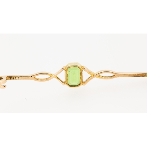 279 - Bezel Set Peridot Brooch Mounted in 15 Carat Yellow Gold 5cm Wide