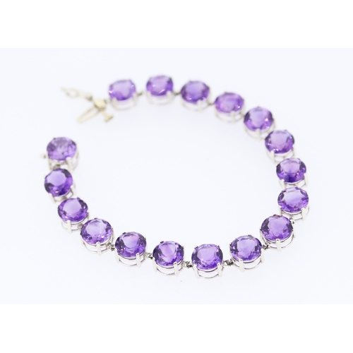 281 - Amethyst Seventeen Stone Set Bracelet Mounted in 14 Carat White Gold 17.5cm Long