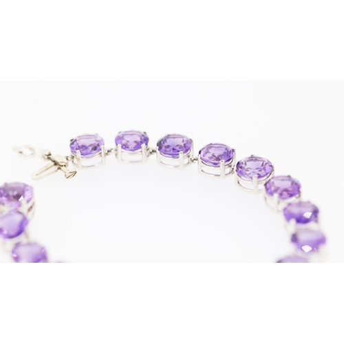 281 - Amethyst Seventeen Stone Set Bracelet Mounted in 14 Carat White Gold 17.5cm Long