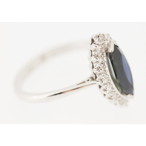 283 - Marquise Cut Sapphire Centre Stone Ring with Diamond Set Surround Set in Platinum Mounted on 18 Cara... 