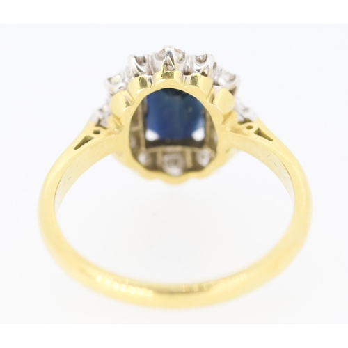 285 - Sapphire Centre Stone Ring with Diamond Set Halo Surround Set in Platinum Mounted on 18 Carat Yellow... 