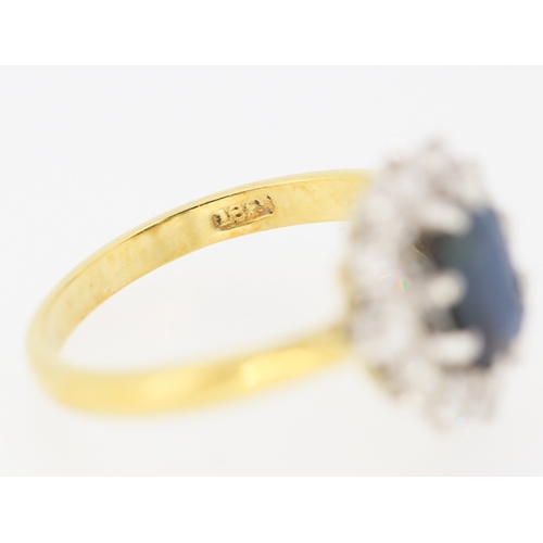 285 - Sapphire Centre Stone Ring with Diamond Set Halo Surround Set in Platinum Mounted on 18 Carat Yellow... 