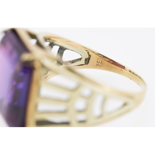 29 - Single Stone Violet Amethyst Set Statement Ring Mounted in 9 Carat Yellow Gold Ring Size S