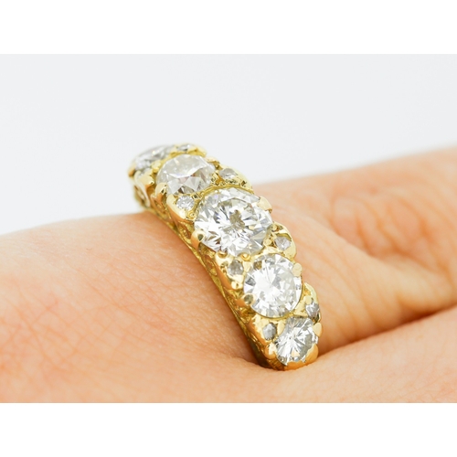 30 - Diamond Five Stone Graduated Form Ring with Further Diamond Insets Mounted in 18 Carat Yellow Gold R... 