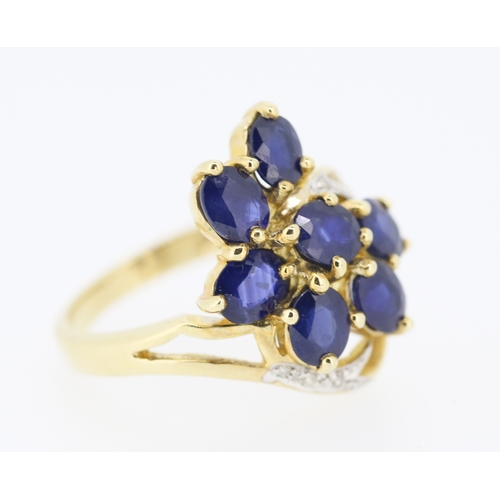 306 - Sapphire Set Seven Stone Floral Form Ring Set in 9 Carat Yellow Gold with Further Diamonds to Settin... 