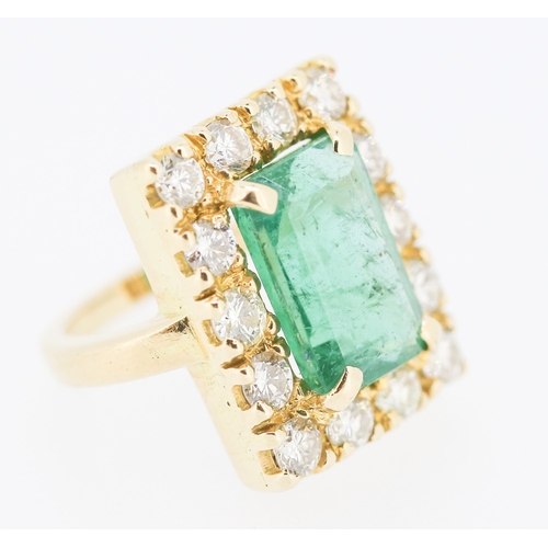 308 - Emerald and Fourteen Diamond Set Ladies Ring Mounted in 18 Carat Yellow Gold Total Emerald Carat Wei... 