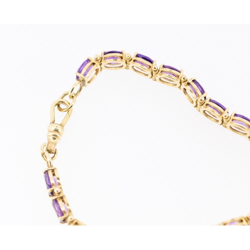 35 - Amethyst Nineteen Stone Set Bracelet Mounted in 9 Carat Yellow Gold 18.5cm Long